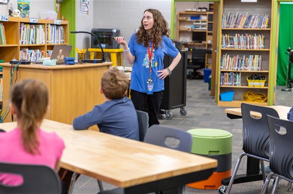 teacher talking to students